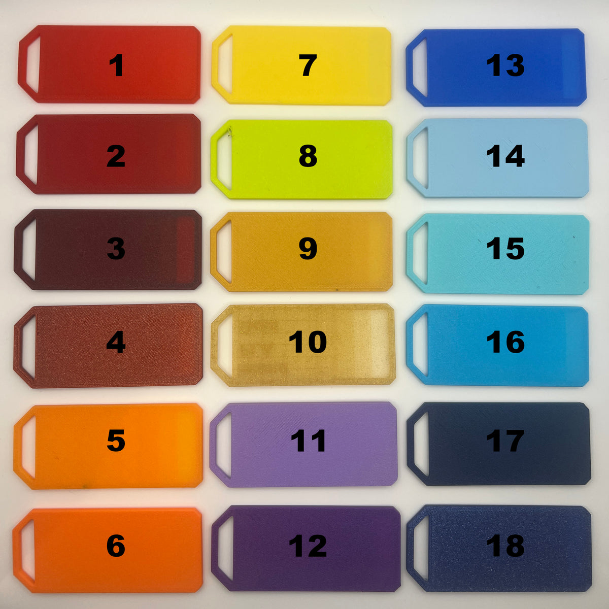 Earring color chart showing color options 1 through 18, including shades of red, orange, yellow, purple and blue.