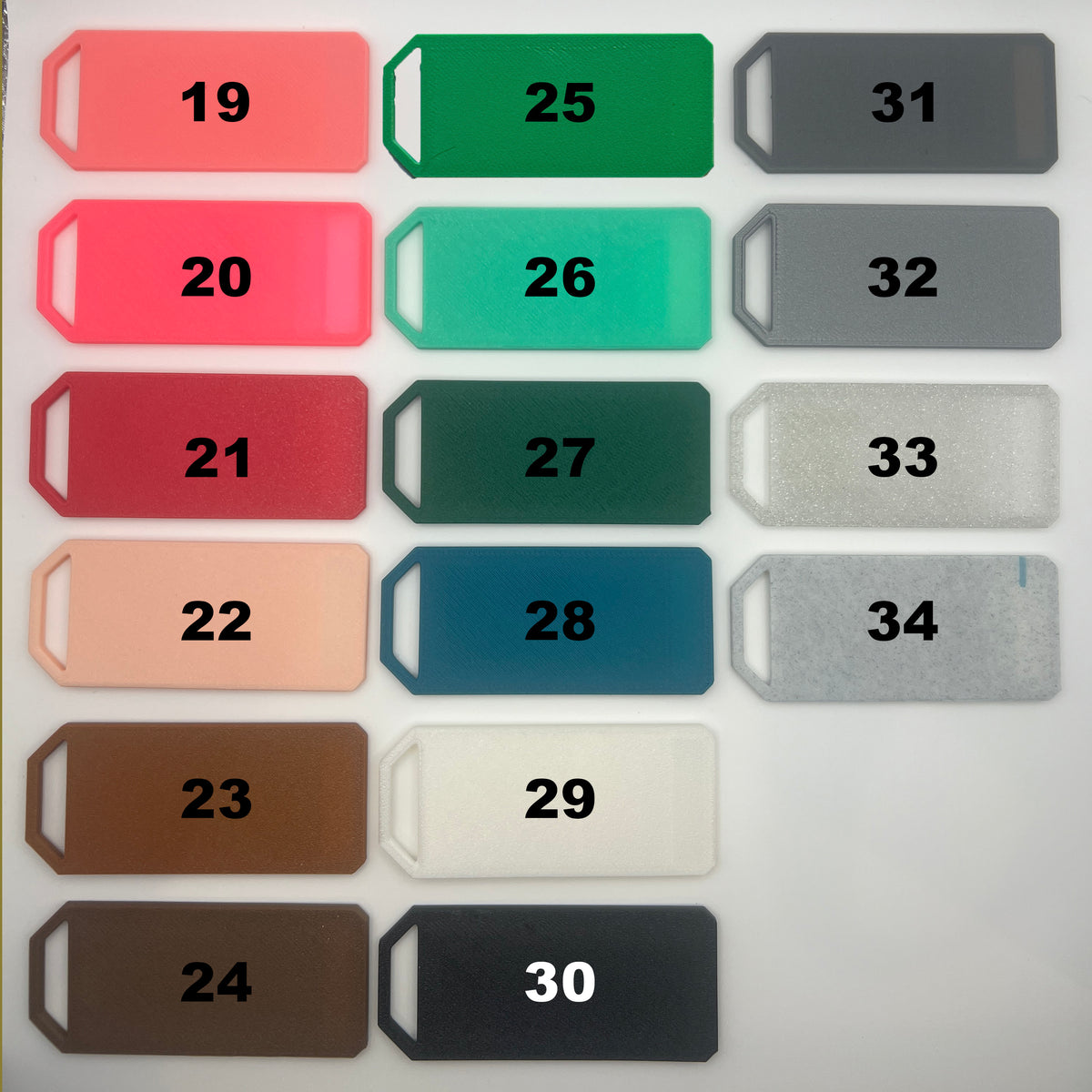 Earring color chart showing color options 19 through 34, including shades of pink, green, teal, brown, black, gray, white and silver.