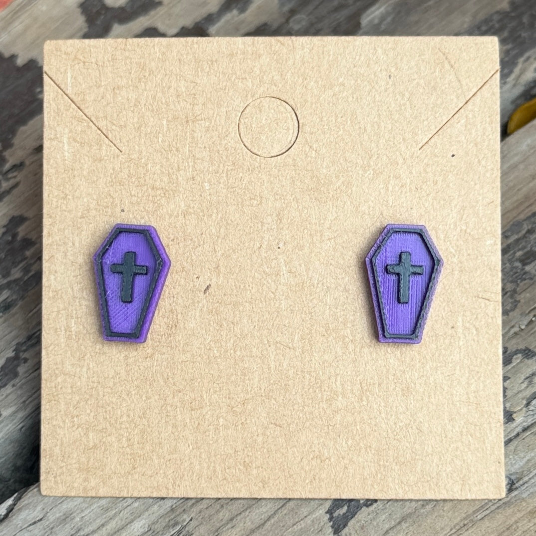 Purple coffin Halloween stud earrings close-up