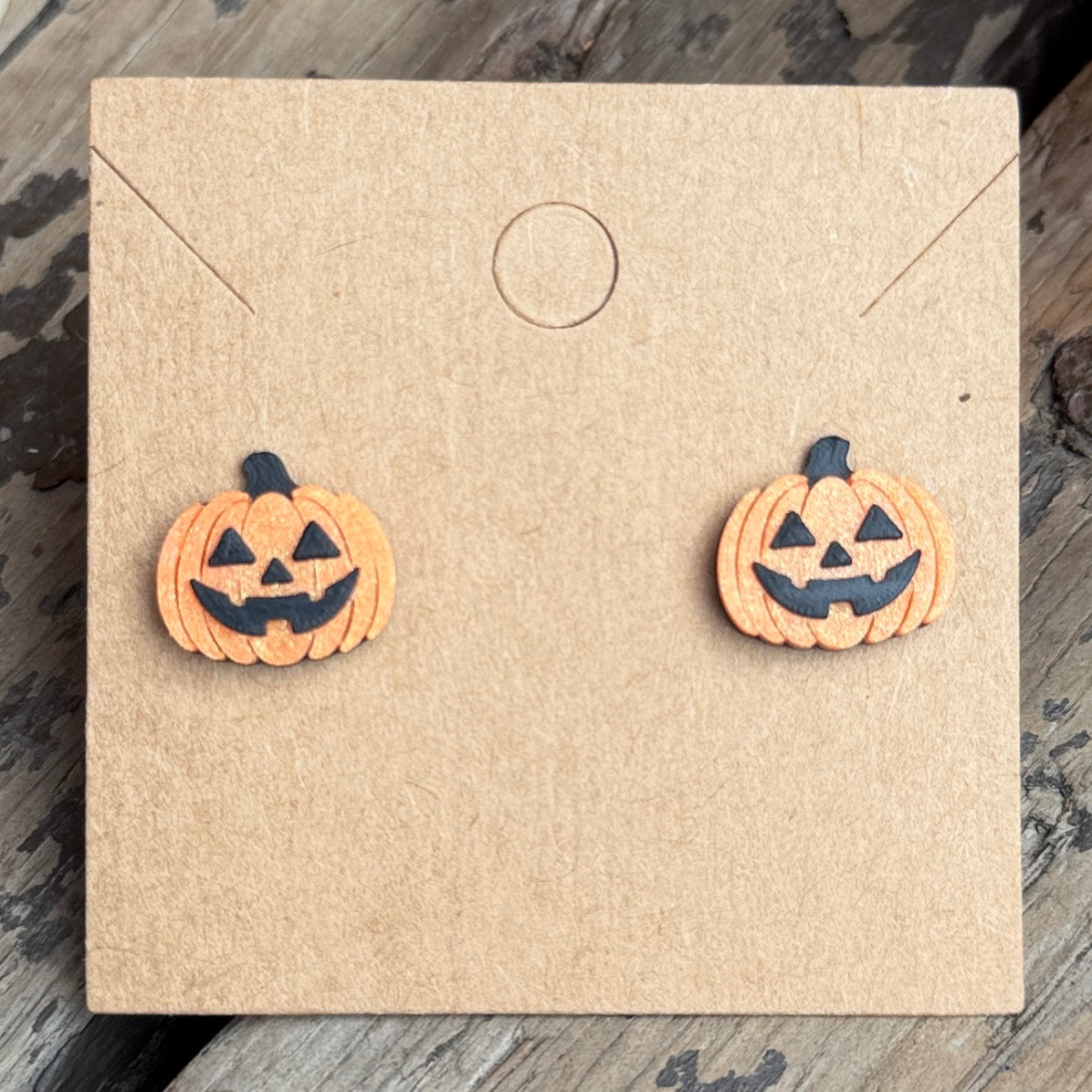 Jack-o-lantern Halloween stud earrings close-up