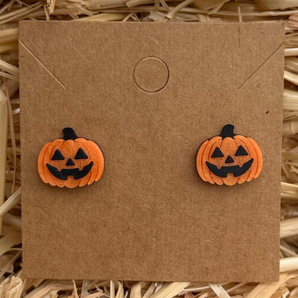 Jack-o-lantern Halloween stud earrings on kraft card