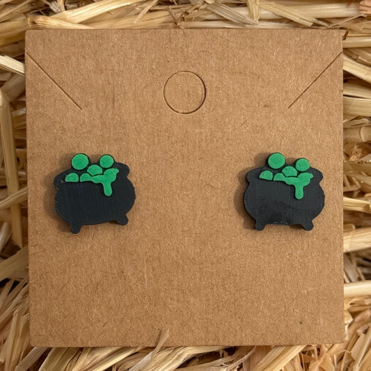 Cauldron Halloween stud earrings on kraft card