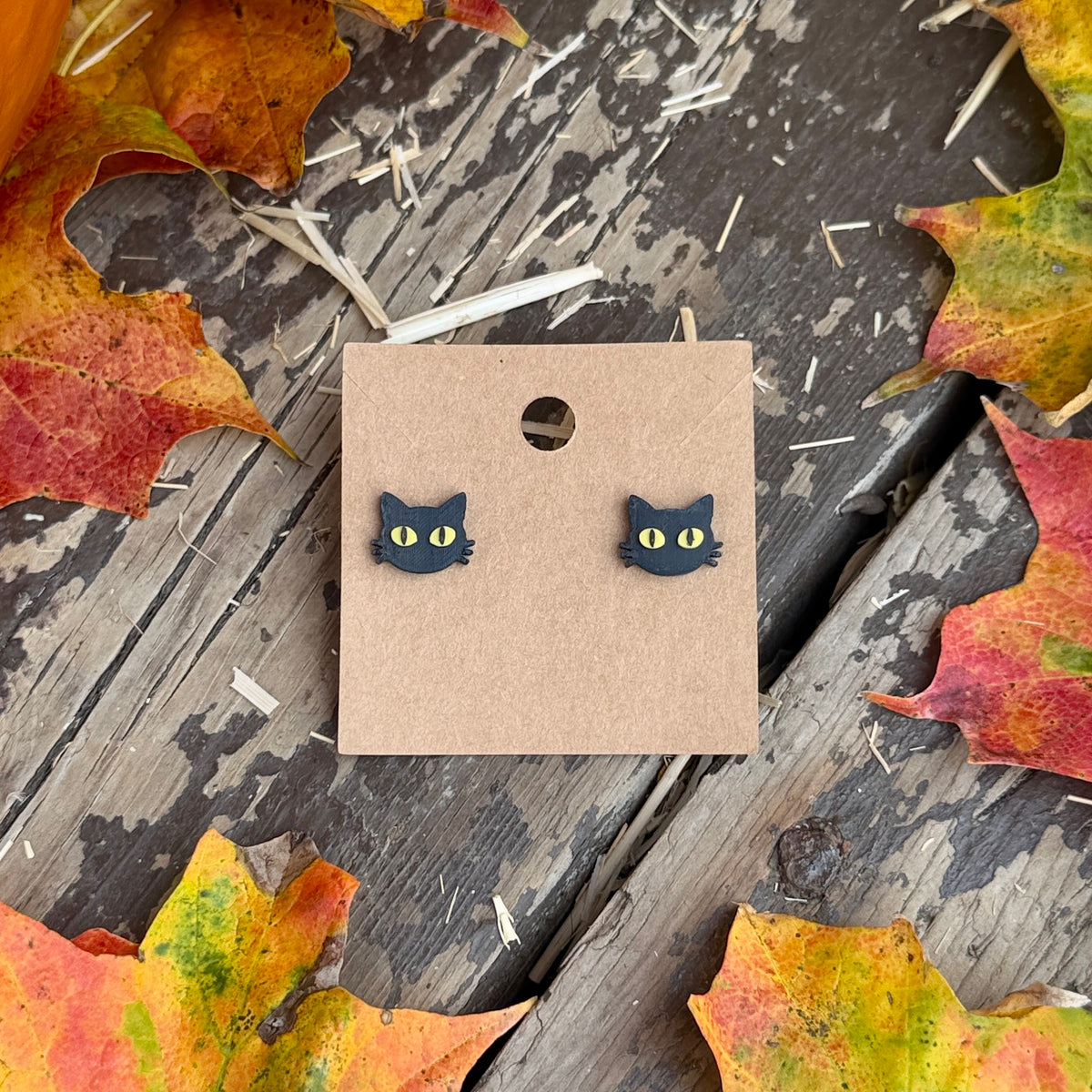Black Cat Face Stud Earrings on kraft earring card