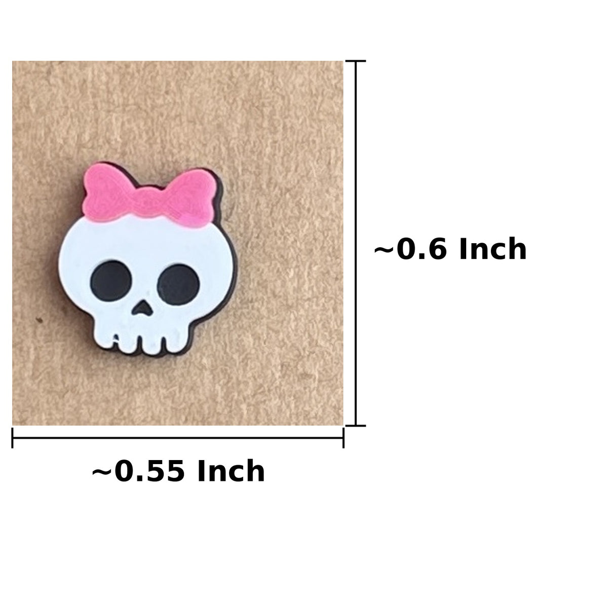 Pink bow skull stud earring dimensions, approximately 0.55 inch wide by 0.6 inch tall